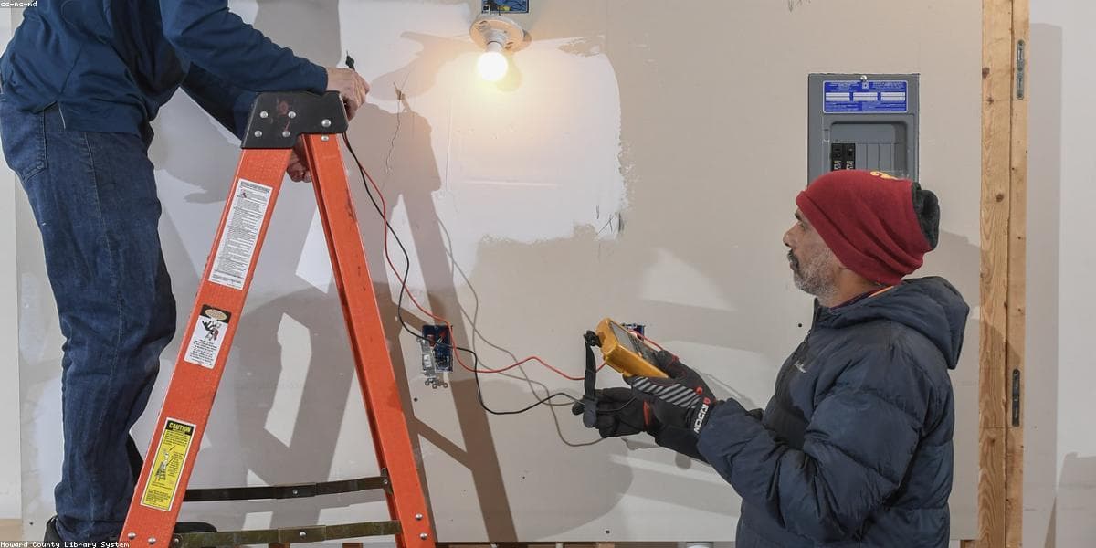 Electrician carrying out electrical work